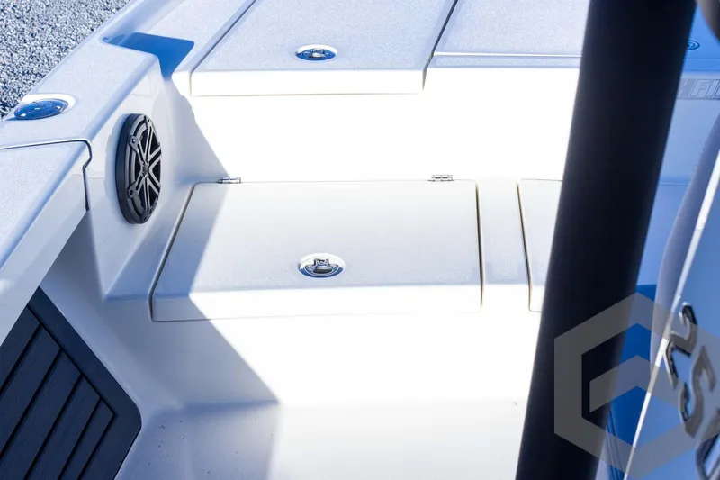 Slide: The Image of 2025 Pathfinder 2500 Hybrid boat interior with storage compartments and speaker. - 25