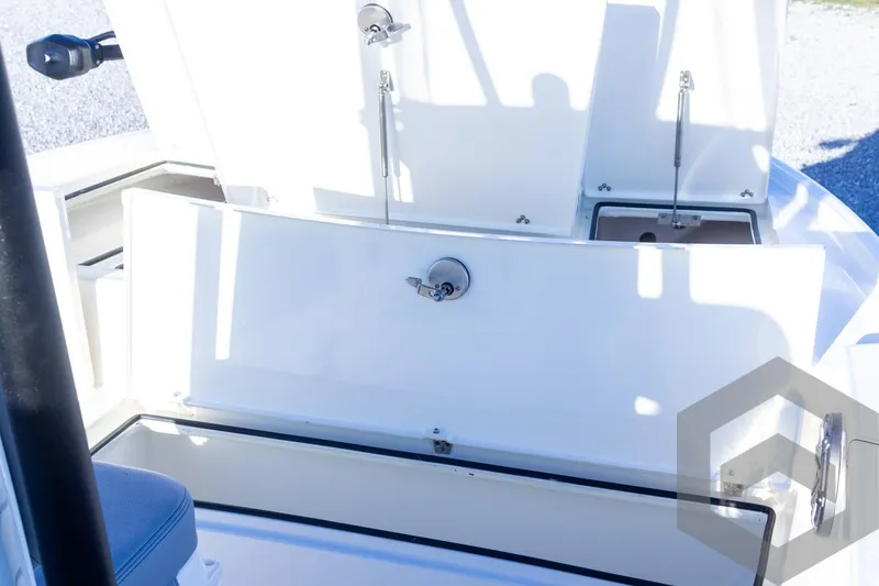 Slide: The Image of 2025 Pathfinder 2500 Hybrid boat storage compartments open, showcasing interior design. - 26