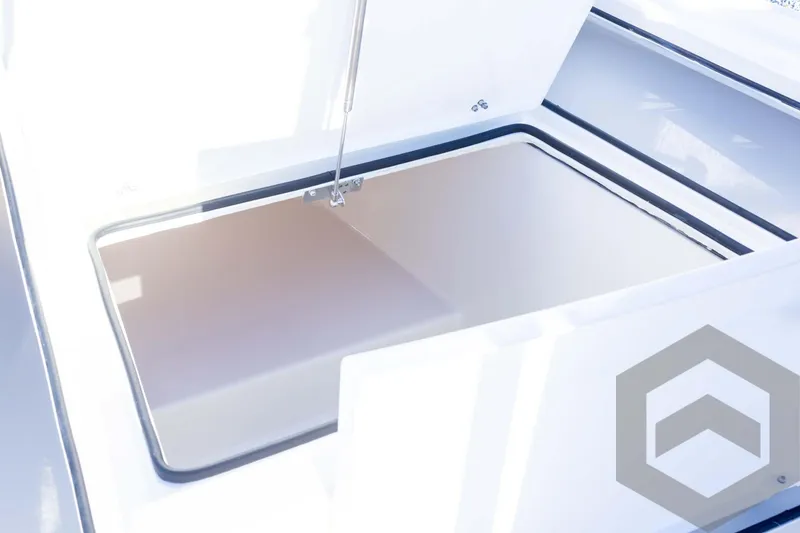 Slide: The Image of Pathfinder 2500 Hybrid 2025 boat storage compartment with open hatch. - 29