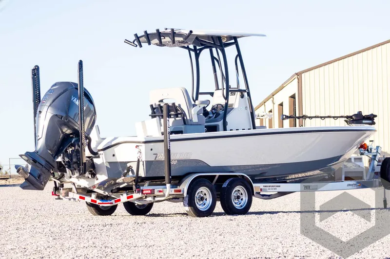 Slide: The Image of 2025 Pathfinder 2500 Hybrid boat on trailer, parked outdoors. - 3