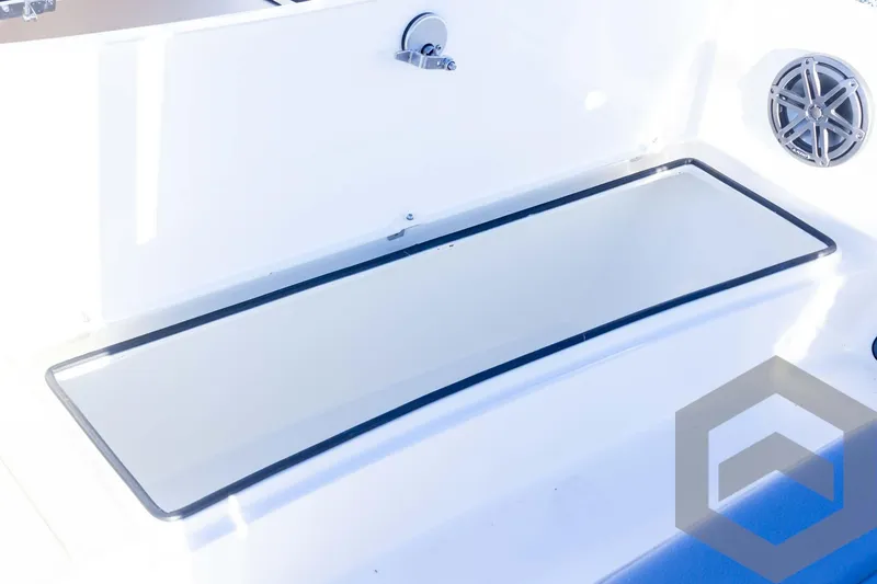 Slide: The Image of 2025 Pathfinder 2500 Hybrid boat interior with storage compartment and speaker. - 30