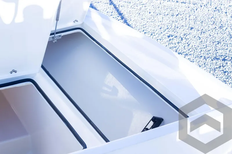 Slide: The Image of Pathfinder 2500 Hybrid 2025 boat storage compartment with open hatch, showcasing spacious interior. - 31