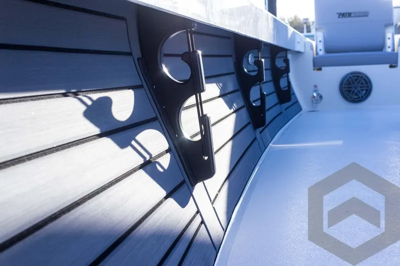 Slide: The Image of 2025 Pathfinder 2500 Hybrid boat interior with rod holders and seating. - 35