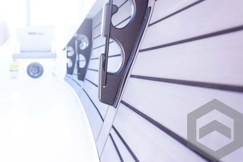 Slide: The Image of 2025 Pathfinder 2500 Hybrid boat interior with sleek design and cup holders. - 38