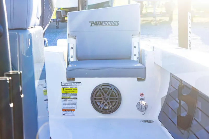 Slide: The Image of 2025 Pathfinder 2500 Hybrid boat interior with seating and speaker system. - 39