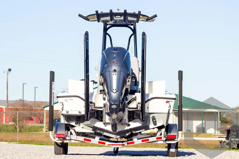 Slide: The Image of 2025 Pathfinder 2500 Hybrid boat on trailer, rear view, outdoor setting. - 4