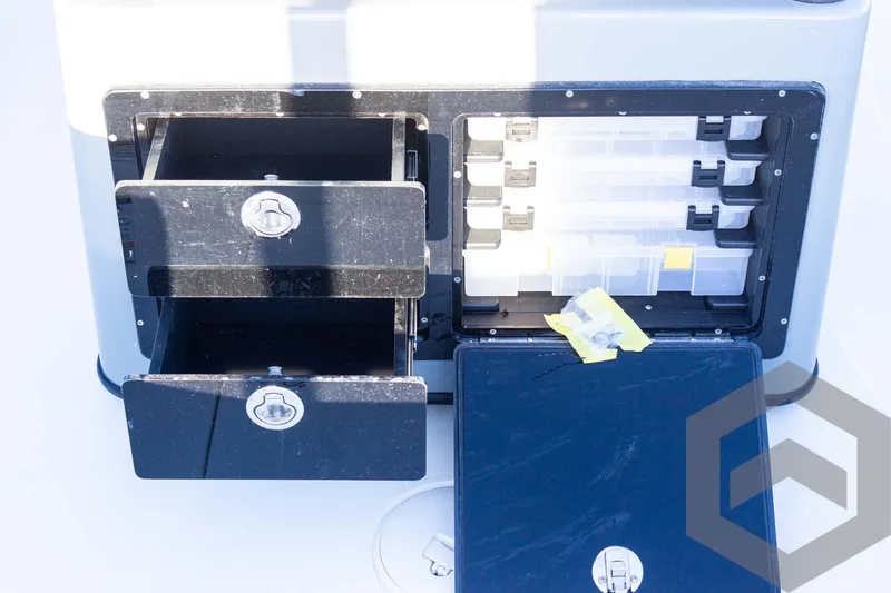 Slide: The Image of Pathfinder 2500 Hybrid 2025 storage compartments with drawers and tackle boxes. - 42