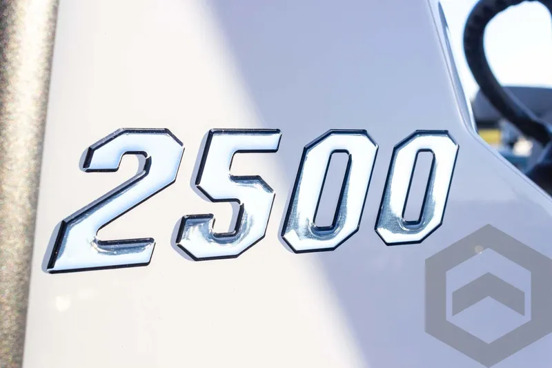 Slide: The Image of Pathfinder 2500 Hybrid 2025 model emblem in shiny chrome finish. - 44