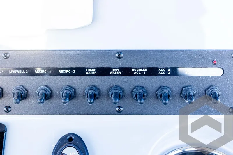 Slide: The Image of Control panel of 2025 Pathfinder 2500 Hybrid boat with labeled switches. - 47