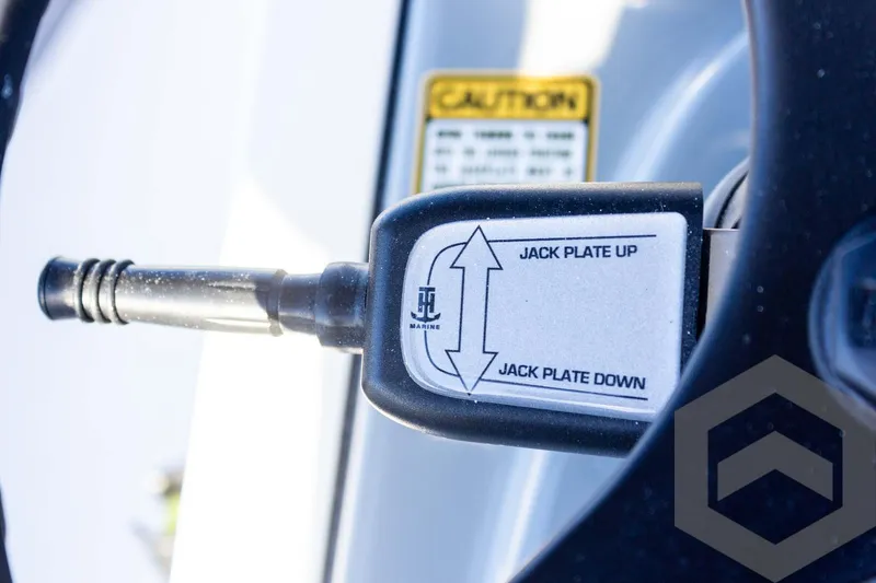 Slide: The Image of Pathfinder 2500 Hybrid 2025 jack plate control with caution label. - 49