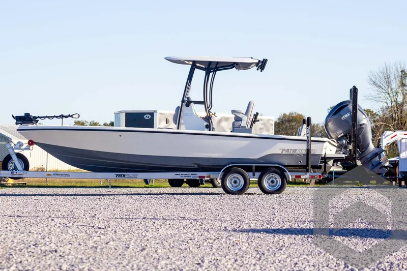 Slide: The Image of 2025 Pathfinder 2500 Hybrid boat on trailer, side view, outdoors. - 6
