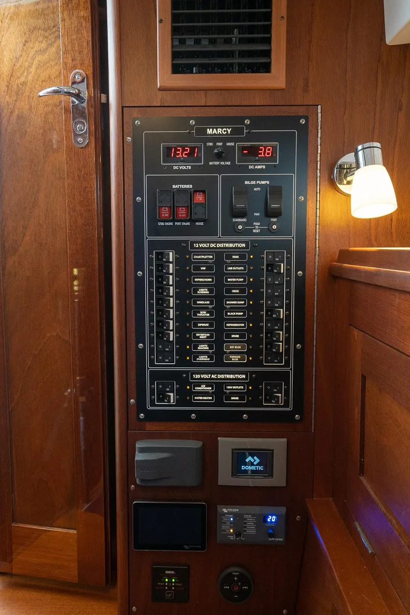 Slide: The Image of Electrical panel inside 2021 Brooklin Boat Yard 32 Express, featuring switches and gauges. - 18