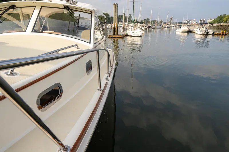 Slide: The Image of 2021 Brooklin Boat Yard 32 Express docked in a serene marina setting. - 22