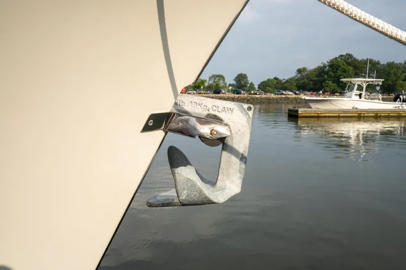 Slide: The Image of Anchor detail on 2021 Brooklin Boat Yard 32 Express, docked in calm waters. - 24