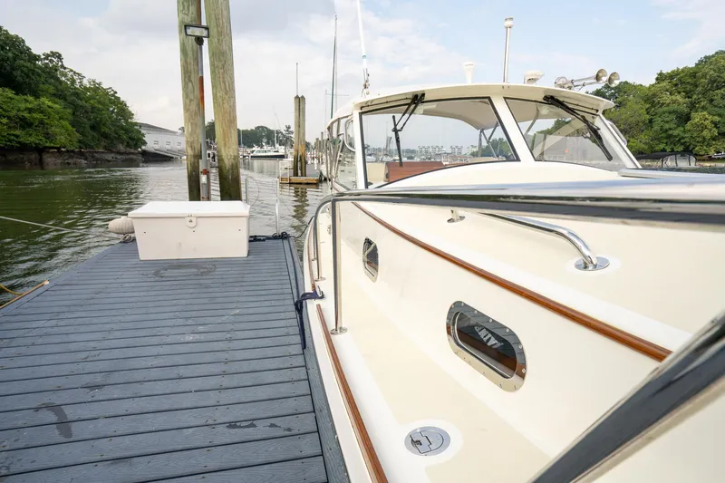 Slide: The Image of 2021 Brooklin Boat Yard 32 Express docked at marina, side view. - 25