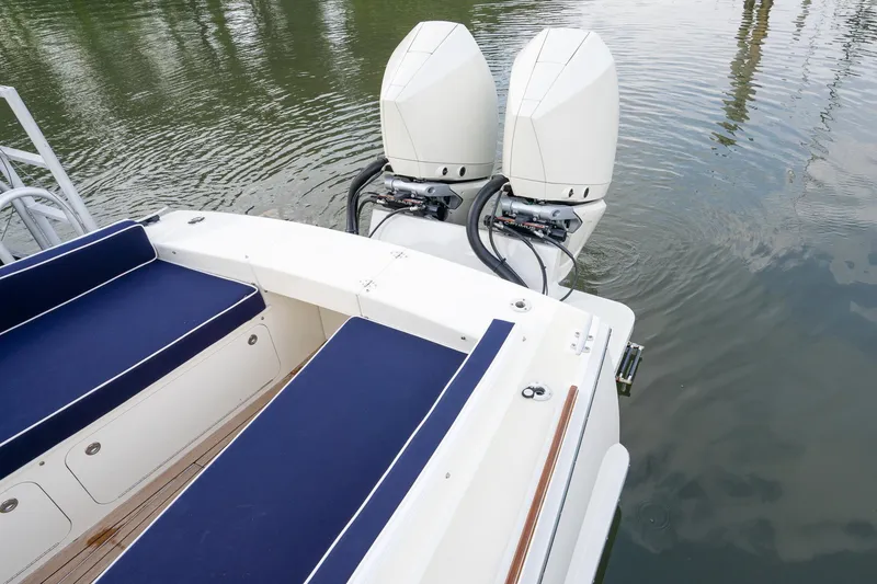 Slide: The Image of 2021 Brooklin Boat Yard 32 Express with dual outboard motors and blue seating. - 26