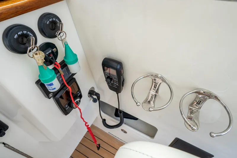 Slide: The Image of Control panel of 2021 Brooklin Boat Yard 32 Express with keys and switches. - 32