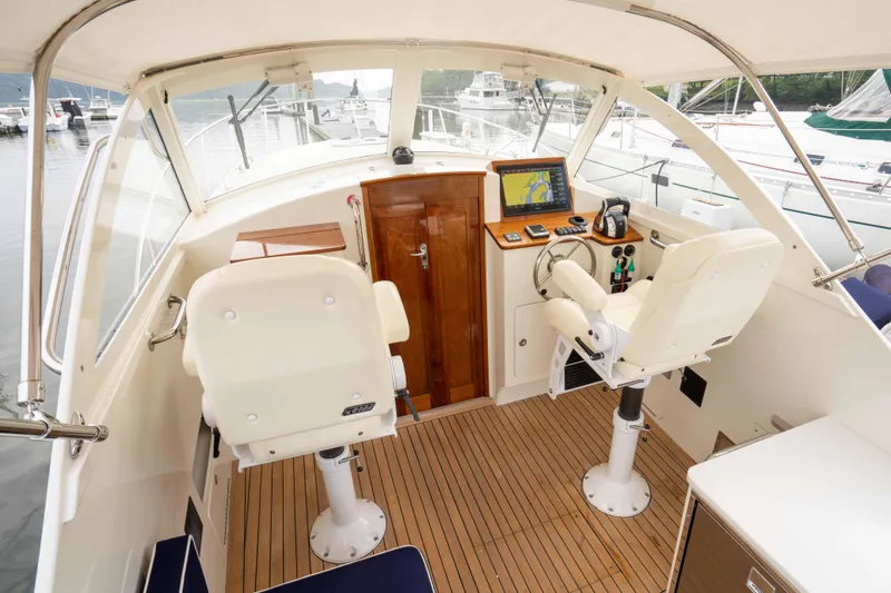 Slide: The Image of Interior of 2021 Brooklin Boat Yard 32 Express with helm and navigation equipment. - 37
