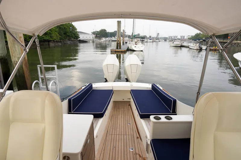 Slide: The Image of 2021 Brooklin Boat Yard 32 Express, elegant interior, docked in a serene marina setting. - 45