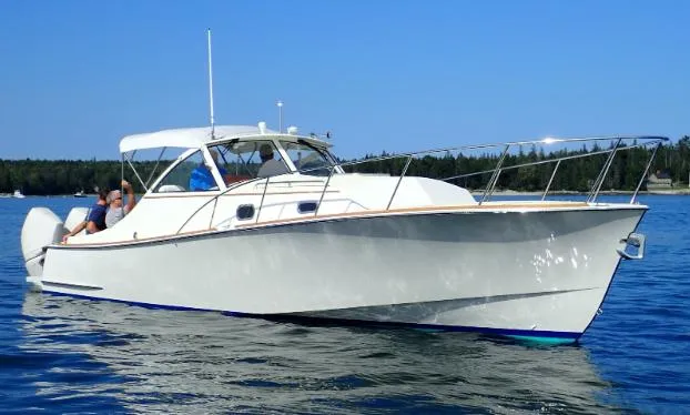 Slide: The Image of Brooklin Boat Yard 32 Express 2021 cruising on calm blue waters. - 46