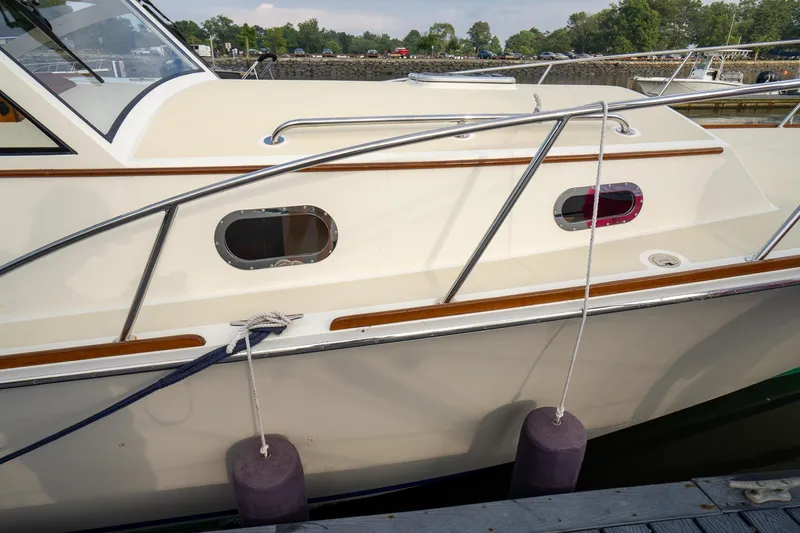 Slide: The Image of 2021 Brooklin Boat Yard 32 Express docked, showcasing sleek design and polished wood accents. - 8
