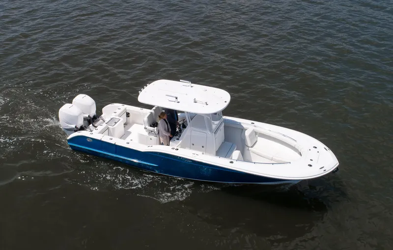 The Image of 2025 Buddy Davis 28 Center Console boat cruising on open water. - 1