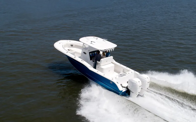 Slide: The Image of 2025 Buddy Davis 28 Center Console boat cruising on open water. - 16