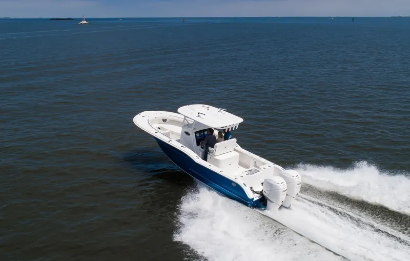 Slide: The Image of 2025 Buddy Davis 28 Center Console boat cruising on open water. - 17