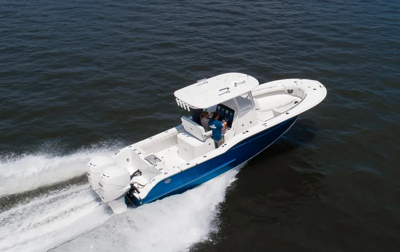 Slide: The Image of 2025 Buddy Davis 28 Center Console boat cruising on open water. - 20