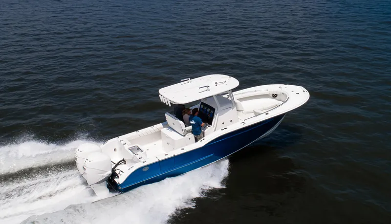 Slide: The Image of 2025 Buddy Davis 28 Center Console boat cruising on open water. - 22