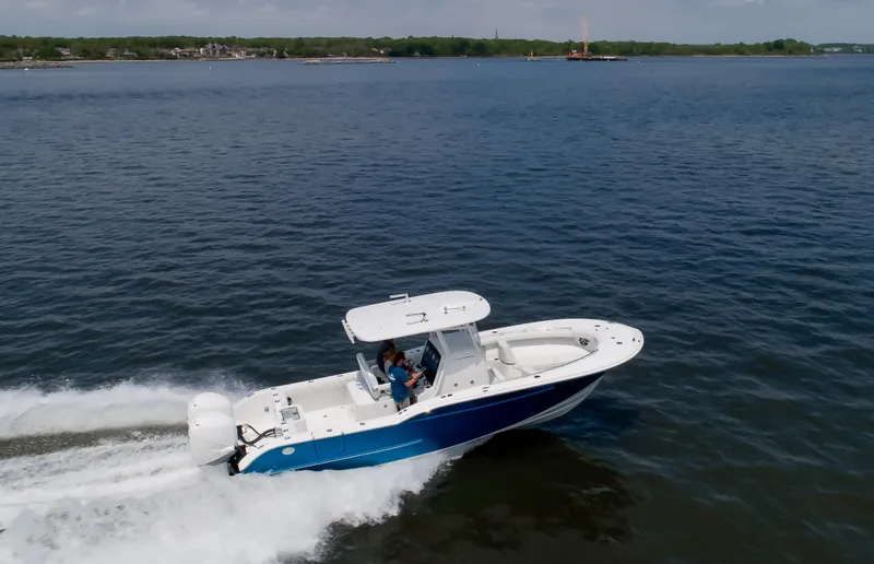 Slide: The Image of 2025 Buddy Davis 28 Center Console boat cruising on open water. - 23