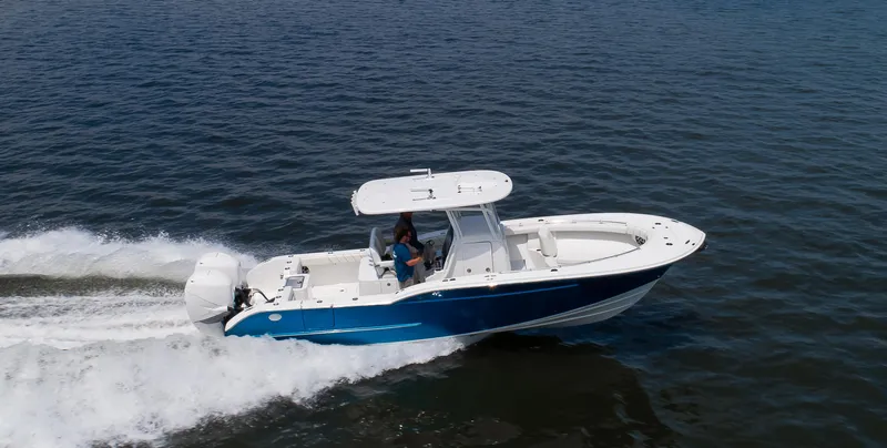 Slide: The Image of 2025 Buddy Davis 28 Center Console boat cruising on open water. - 26