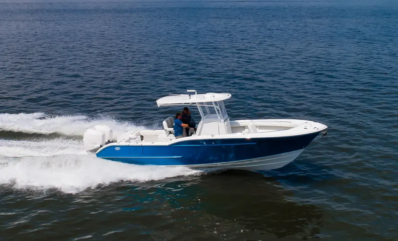 Slide: The Image of 2025 Buddy Davis 28 Center Console boat cruising on open water. - 30