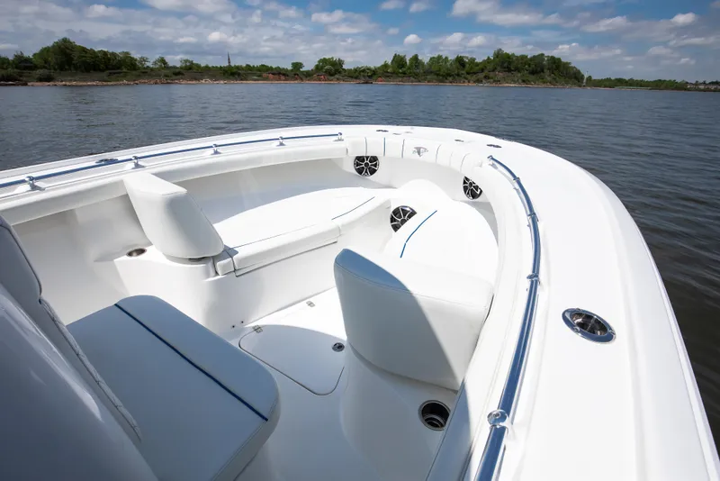 Slide: The Image of 2025 Buddy Davis 28 Center Console boat on calm water, featuring sleek seating and design. - 35