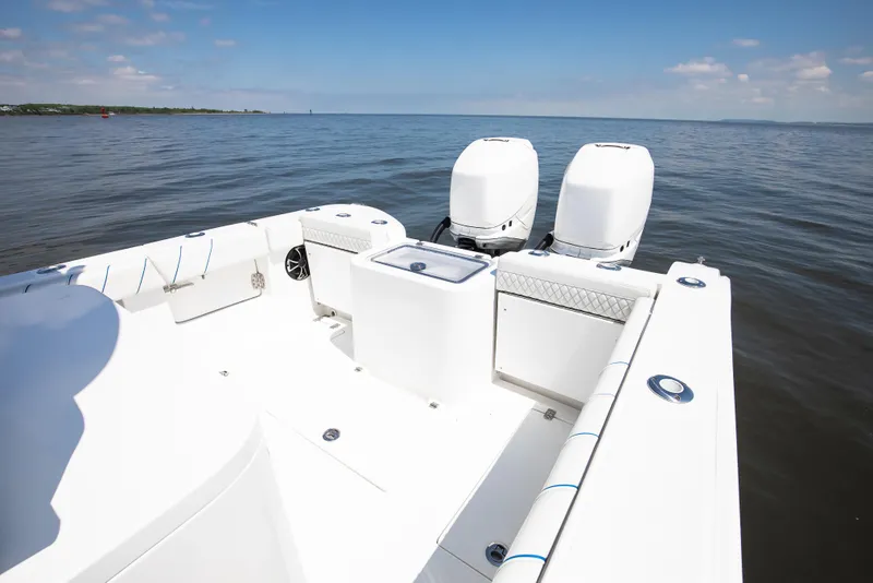 Slide: The Image of 2025 Buddy Davis 28 Center Console boat on calm water, featuring dual engines. - 40
