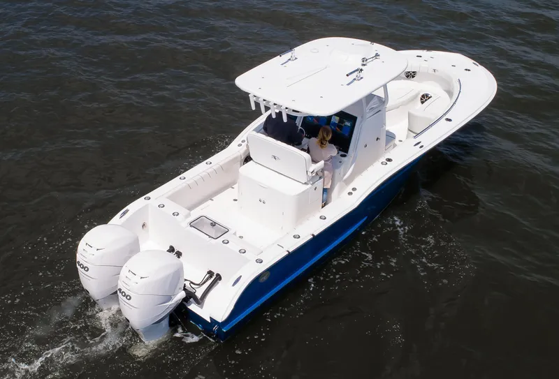 Slide: The Image of 2025 Buddy Davis 28 Center Console boat cruising on open water. - 49