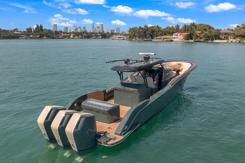 Slide: The Image of 2025 Buddy Davis PININFARINA 47 CC boat on calm water with city skyline. - 12