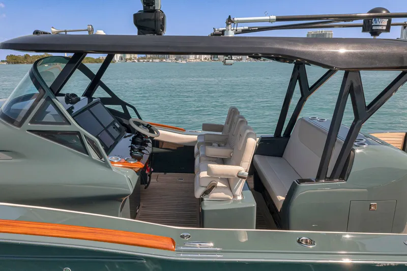 Slide: The Image of 2025 Buddy Davis PININFARINA 47 CC luxury yacht interior with modern seating and navigation controls. - 21