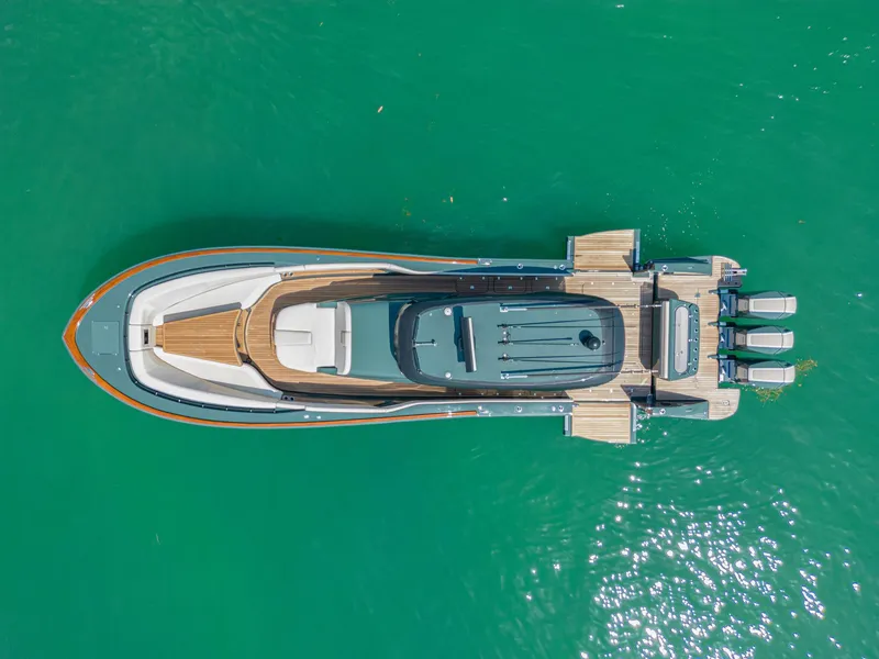 Slide: The Image of Aerial view of 2025 Buddy Davis PININFARINA 47 CC yacht on turquoise water. - 25