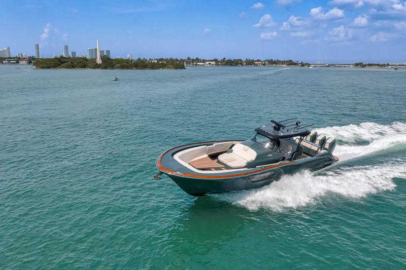 Slide: The Image of 2025 Buddy Davis PININFARINA 47 CC cruising on clear blue waters under a sunny sky. - 33