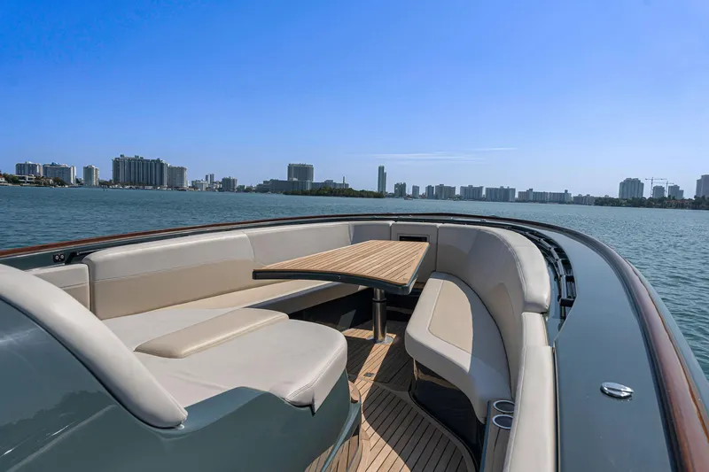 Slide: The Image of Luxurious 2025 Buddy Davis PININFARINA 47 CC yacht with elegant seating and scenic waterfront view. - 42