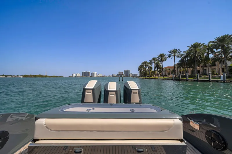 Slide: The Image of Luxury Buddy Davis PININFARINA 47 CC boat on scenic waterfront, 2025 model. - 47