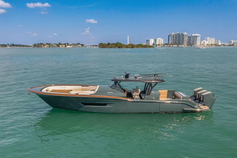 Slide: The Image of 2025 Buddy Davis PININFARINA 47 CC luxury boat on calm waters, cityscape in background. - 6