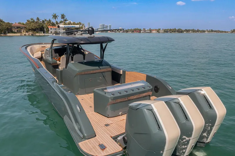 Slide: The Image of Luxury 2025 Buddy Davis PININFARINA 47 CC boat with triple engines on calm water. - 9