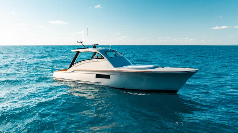 The Image of 2025 Buddy Davis 52 Express yacht cruising on open ocean waters. - 0