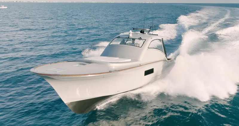 Slide: The Image of 2025 Buddy Davis 52 Express yacht cruising on open sea. - 17