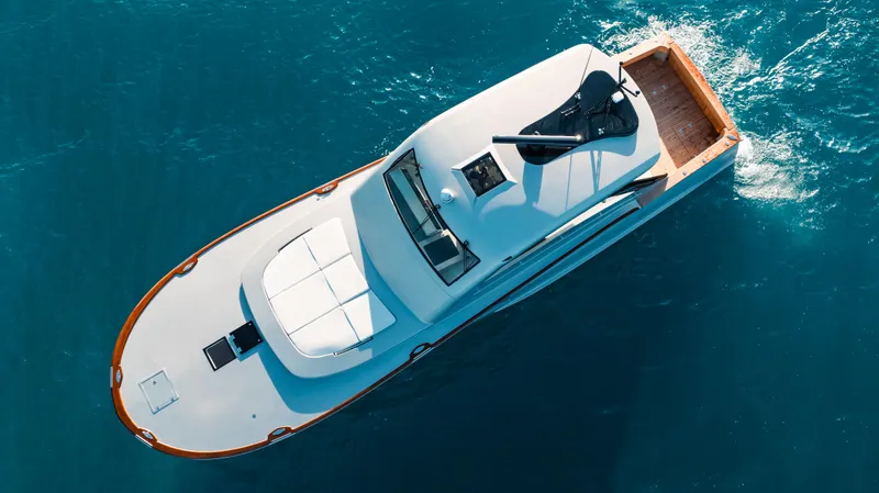 Slide: The Image of Aerial view of 2025 Buddy Davis 52 Express yacht cruising in blue ocean waters. - 20