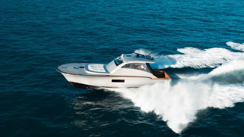 Slide: The Image of 2025 Buddy Davis 52 Express yacht cruising swiftly on open ocean waters. - 30