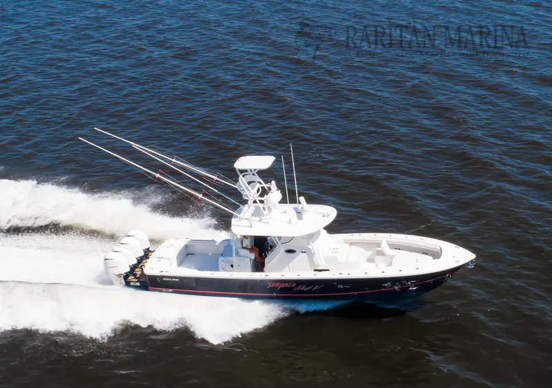 Slide: The Image of 2016 Regulator 41 boat cruising on open water, equipped with multiple fishing rods. - 20