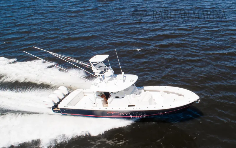 Slide: The Image of 2016 Regulator 41 boat cruising on open water, aerial view. - 23
